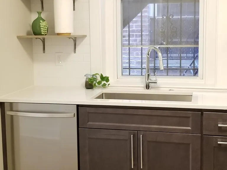 Kitchen includes excellent samsung dishwasher and large stainless sink. Counter is composite stone.