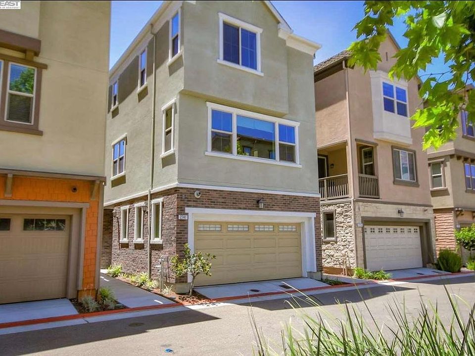 Front of the home with 2-car garage with remote-open garage door capability. 3 guest parking spaces in front of home for easy visitor access.