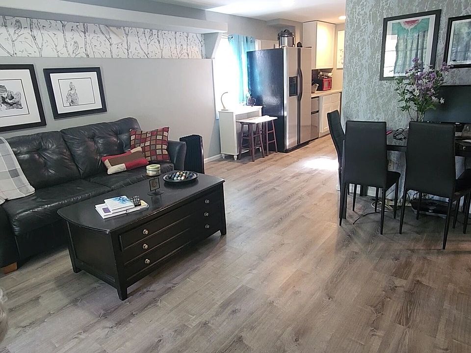This view is from the entrance; living room is bright and open