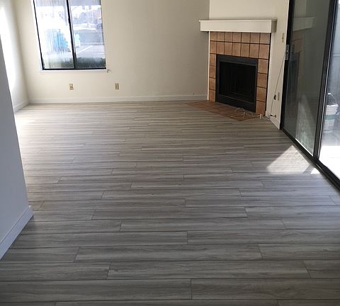 Family room view from breakfast nook area. Sliding door to back patio on right.