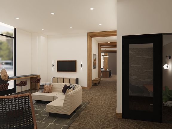 Coworking spaces with comfortable seating and private workstations.