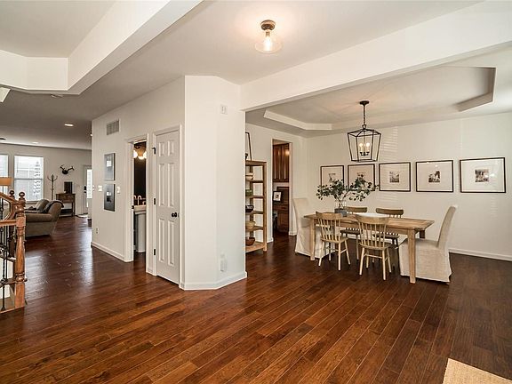 Wide open floor plan! Main level boasts a beautiful engineered handscraped Wood Flooring! Formal Dining Room to the right as you enter.