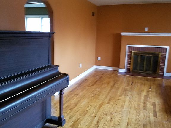 Living room. Paint color has been updated since this photo to a neutral shade. (Piano not included).