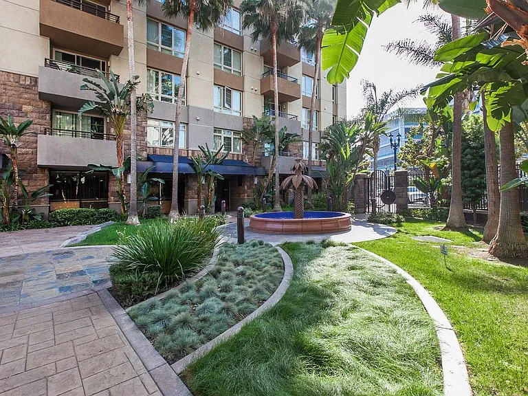 Lush courtyard at ground level. This is what you see from the balcony and master bedroom.