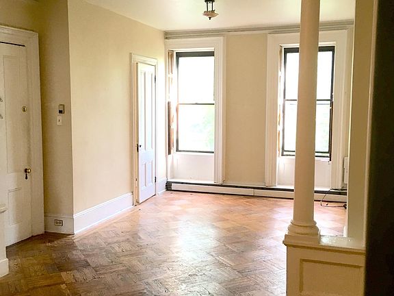 living room/dining room facing south toward the street