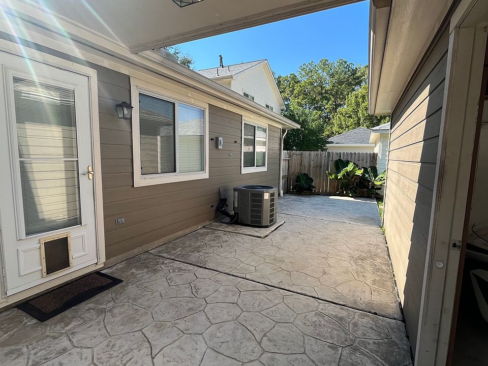 Patio with breeze way to garage