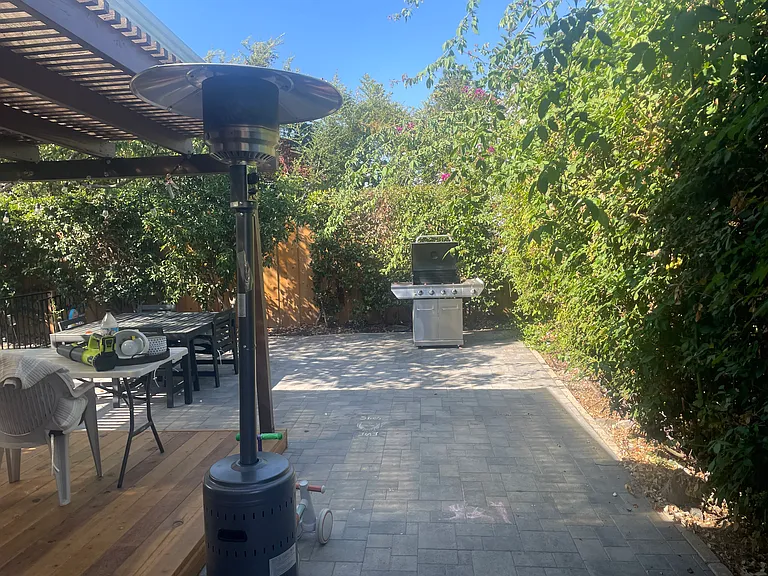 Beautiful Stonework in Backyard with B B Q & Heaters