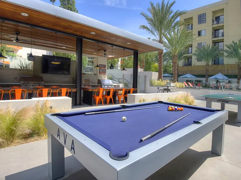 Outdoor Kitchen with Grills and Game Tables