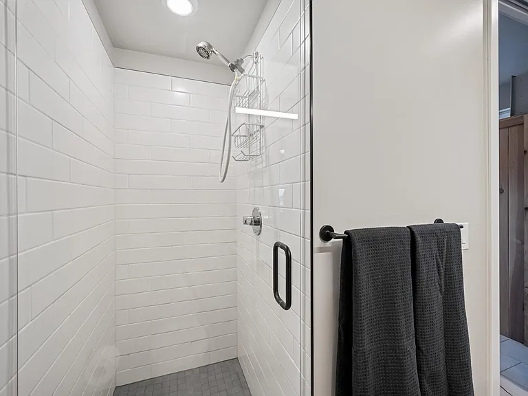 This en suite bathroom is tucked away behind the wellness room/Murphy bedroom and has it's own shower, sink, and toilet. Enjoy privacy from the rest of your party in this private hidden bathroom dedicated just to you, you wellness lover, you! Namaste