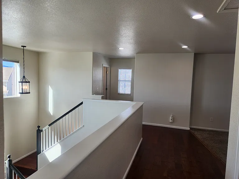 Landing area and 2nd full bath towards front of home