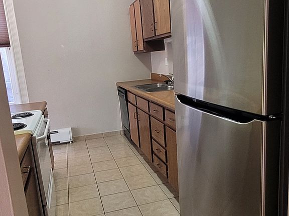 kitchen from entry hallway 
entry into living also in distant to the left
