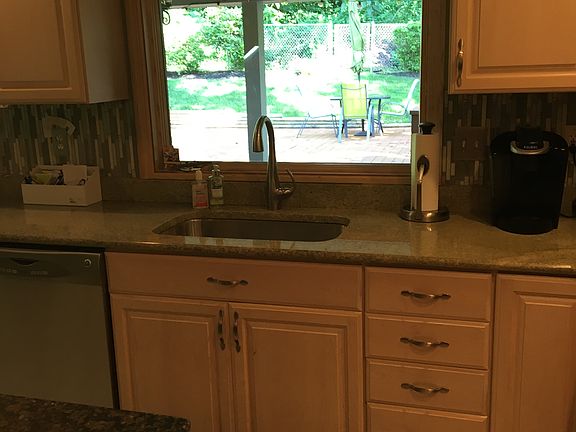 Kitchen overlooks backyard