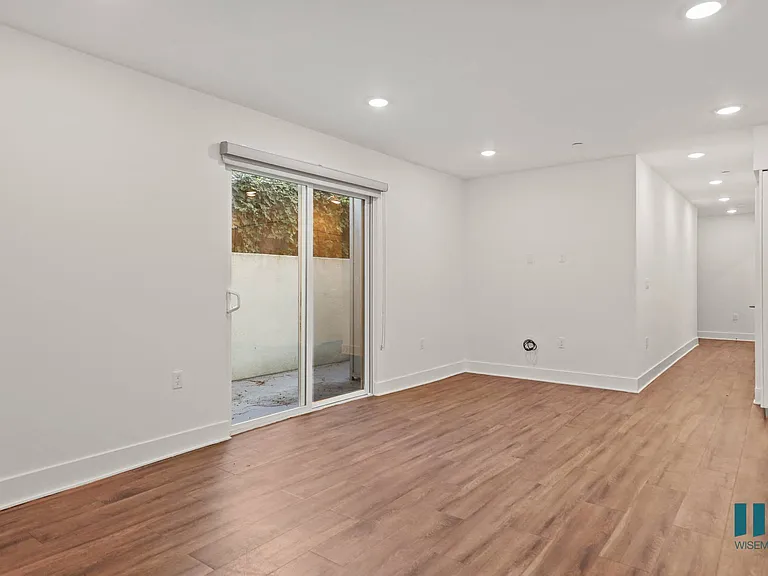 Living Room Space with Patio and Vinyl Flooring