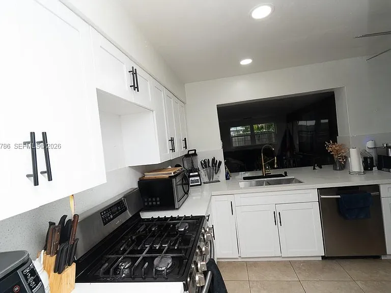 5941 NW 14th Ct — Photo 3