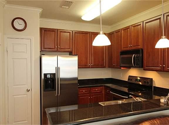 There are more than ample kitchen cabinets and pantry. The 1/2 bath is at top of stairs on second floor.