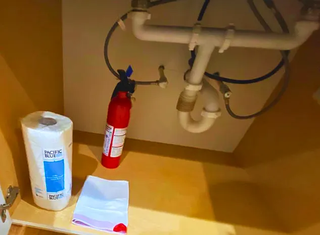 Paper towels, trash bags & a fire extinguisher for added convenience.