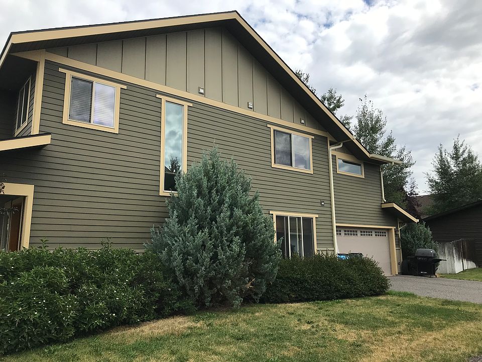 SOUTH SIDE OF CONDO SHOWING 2 CAR GARAGE OFF ALLEY