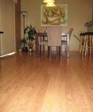 Beautiful manufactored wood floors cover lower level