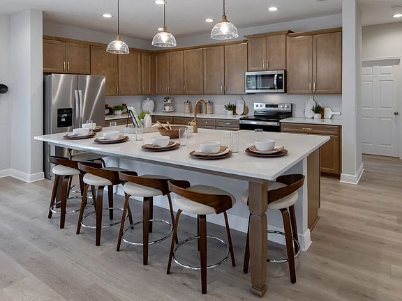 Model Home Kitchen 
Actual home is white cabinets with tile flooring.