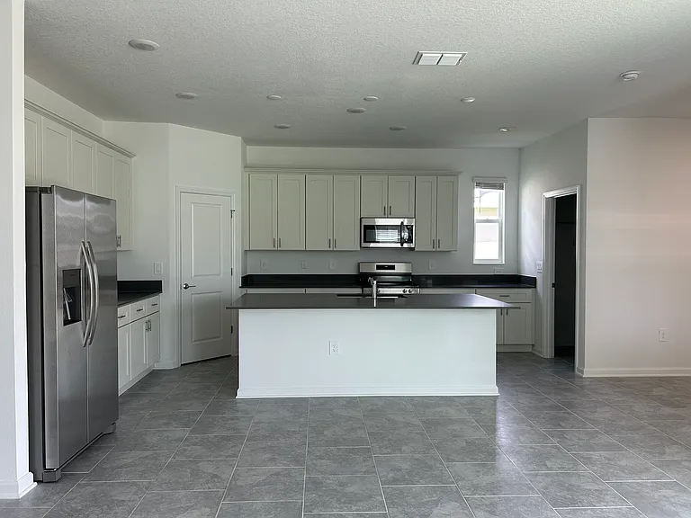 kitchen with stainless steel appliances and quart counter top