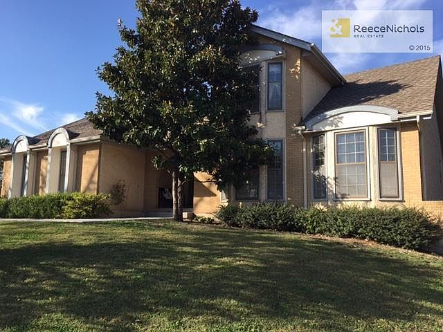 Front of home with brick trim. Home sits on large cul-de-sac lot.