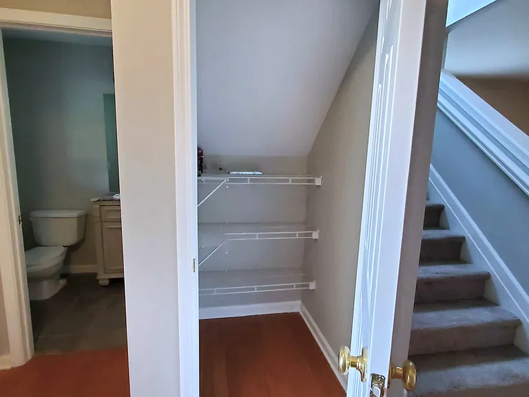 Half bath and large storage closet in foyer.