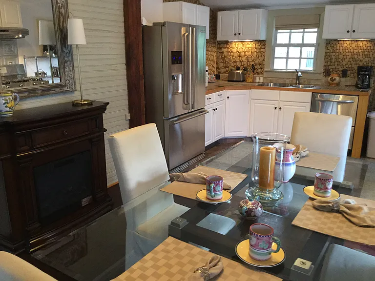 Open dining area and fully equipped kitchen designed for comfortable extended stays.