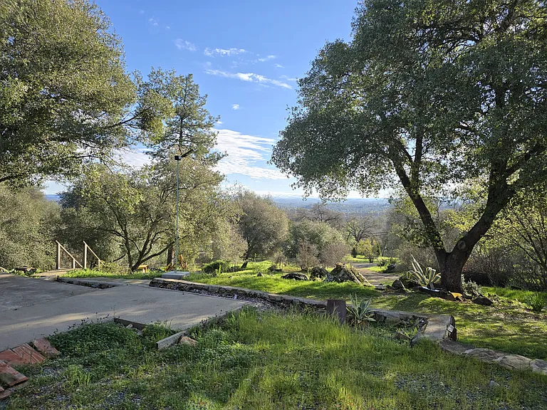 View looking east. Looks far away in the wide angle picture. Actual physical sight of Placerville and the Sierras appears much closer in person.