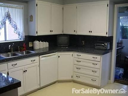 Lots of granite tile countertops
						:
						(bottom left shows corner of bar) Large lazy-susan in corner with a TV cable.