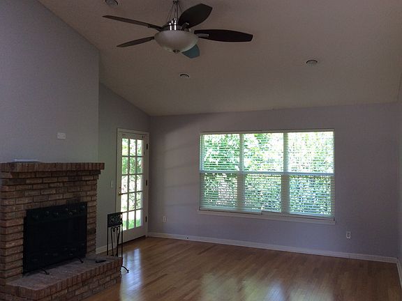 Living room with wood burning fireplace