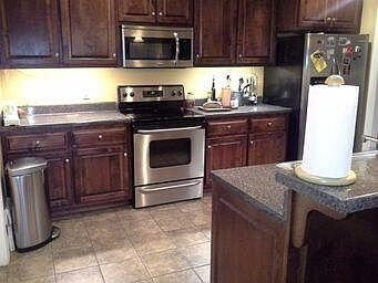 Kitchen with slate floors and stainless steel appliances