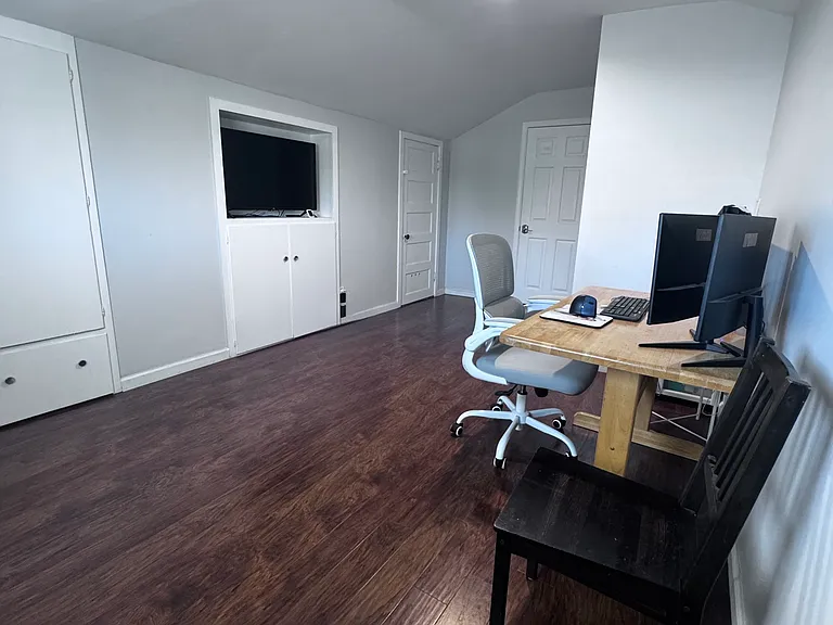 On the second level is a multi-function room. The space has a mini-split for its heating and cooling. This room is approximately 10x17 and leads to another bathroom, the 4th bedroom and a large storage room.