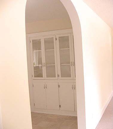 Arched door to kitchen