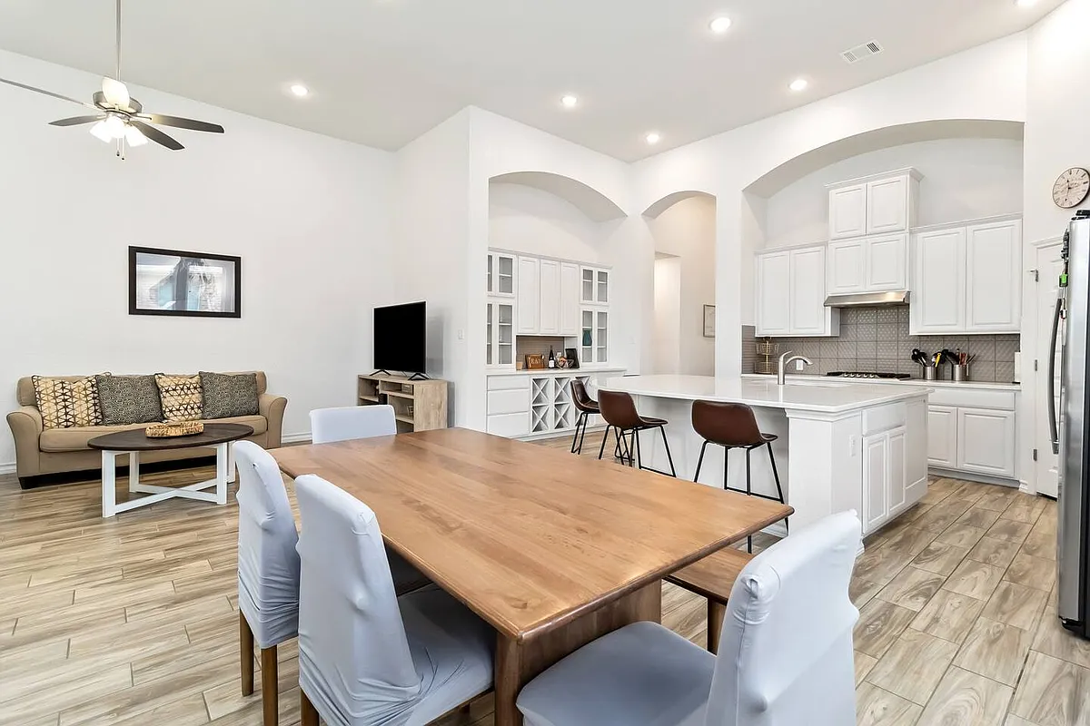 Open kitchen, dining, and living room area with 20' ceilings - 1802 Delafield Rd