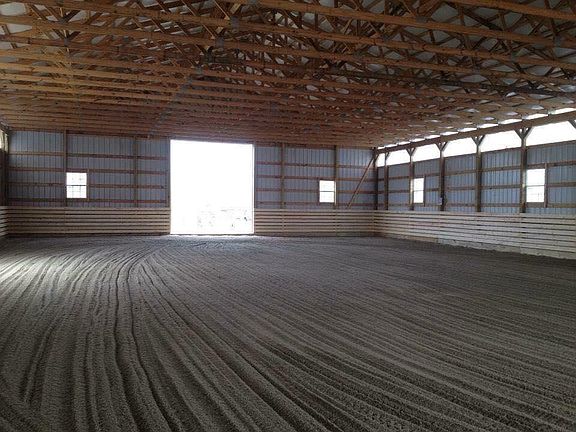 Indoor arena with oak trimmed side walls, multiple windows and great footing.