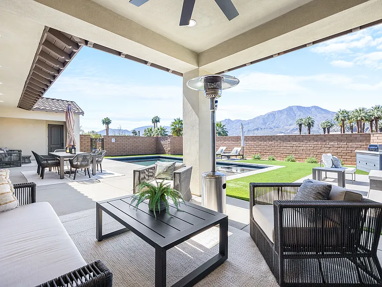 Catch up with your loved ones from the convenience of the covered patio with seating for four.