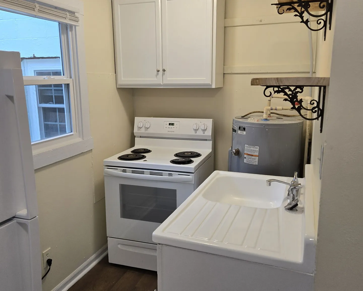 Kitchen, new window, renovated sink rustic shelves new refrigerator new lighting