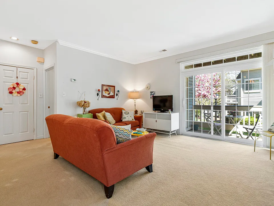 Spacious living area with new sliding glass doors to patio