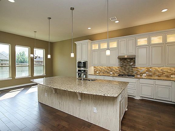 Gorgeous Kitchen with upgraded BRAND NEW Benedenitti cabinetry, refrigerator, vent hood, lighting, backsplash, flooring and MORE! Don t pay for new construction when you can buy this better than new home!