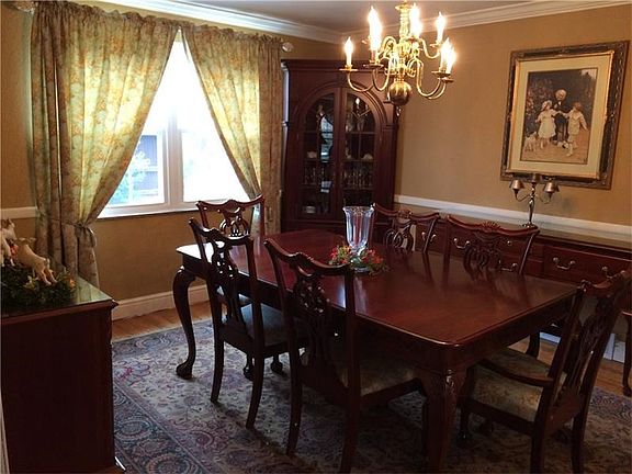 Large window in formal dining room.