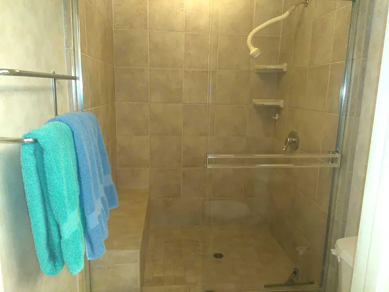 FEATURES INCLUDE A TILED EASY ACCESS SHOWER IN THE PRIMARY BATH WITH BENCH!