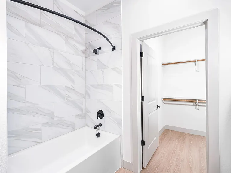 Relax in spa-like soaking tubs and walk-in showers with full-height tile. Experience oversized closets with wood rods and built-in storage.