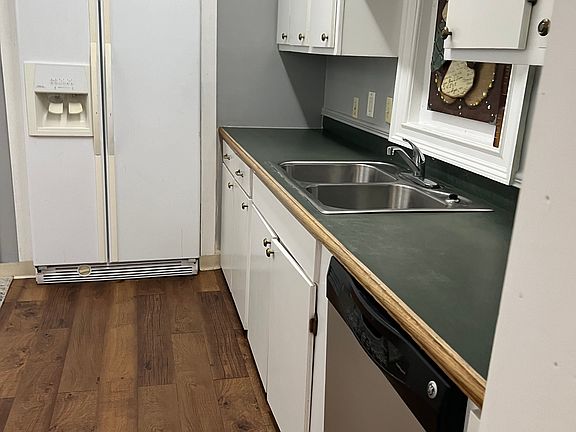 Kitchen with side-by side refrigerator deep double sink