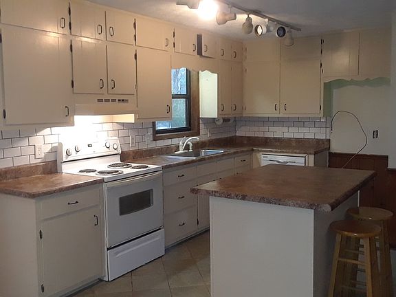 Kitchen with movable island.