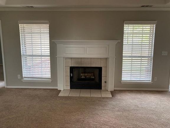 Living area has gas log fireplace