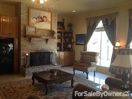 Den
						:
						features gas fireplace and many built-ins