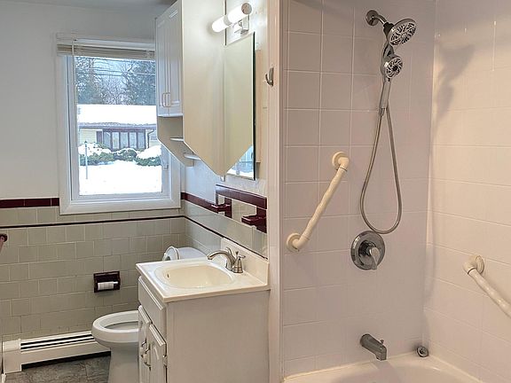 Full bathroom with brand new bath and shower fixtures.