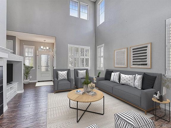 Livingroom and entry door (Virtually staged)