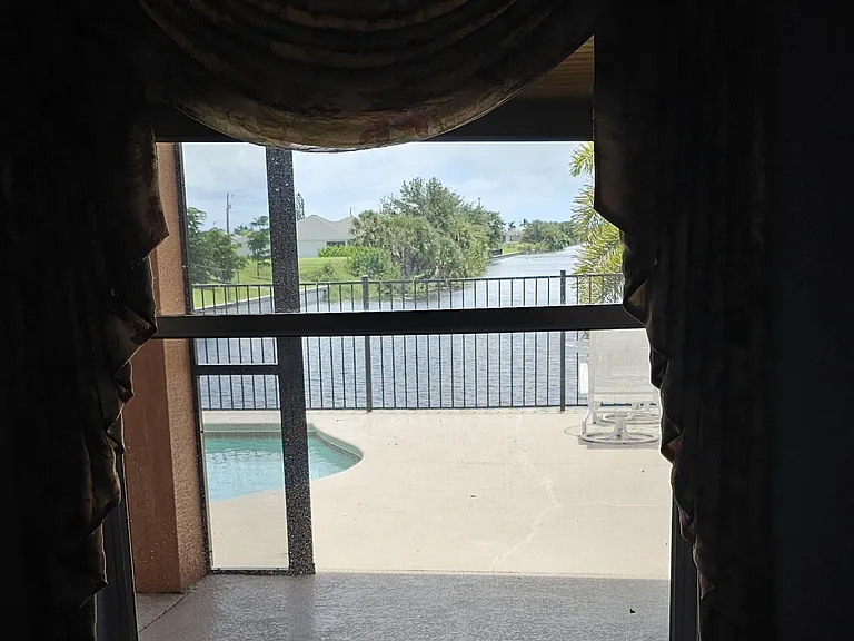 Master Bedroom overlooking pool & canal