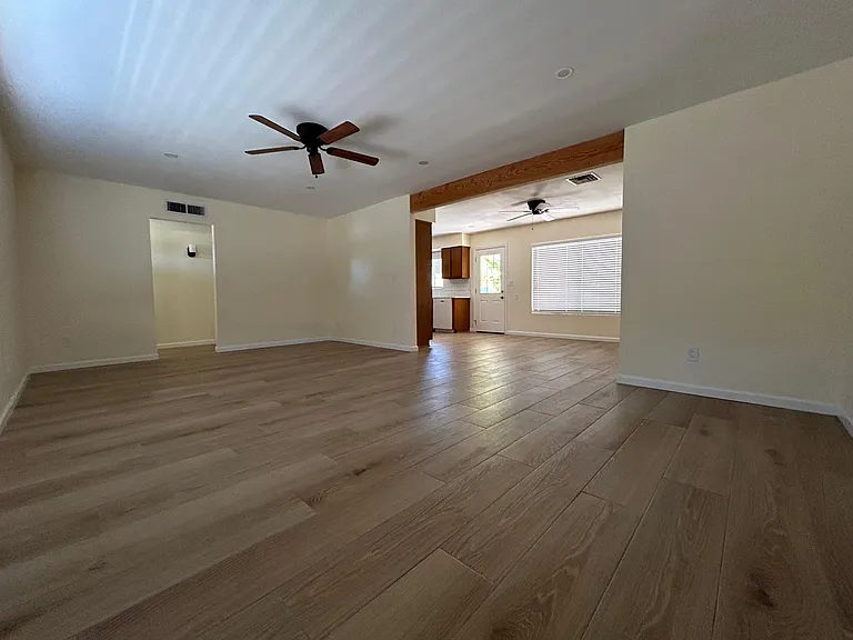 Main living area with view into dining area and kitchen
